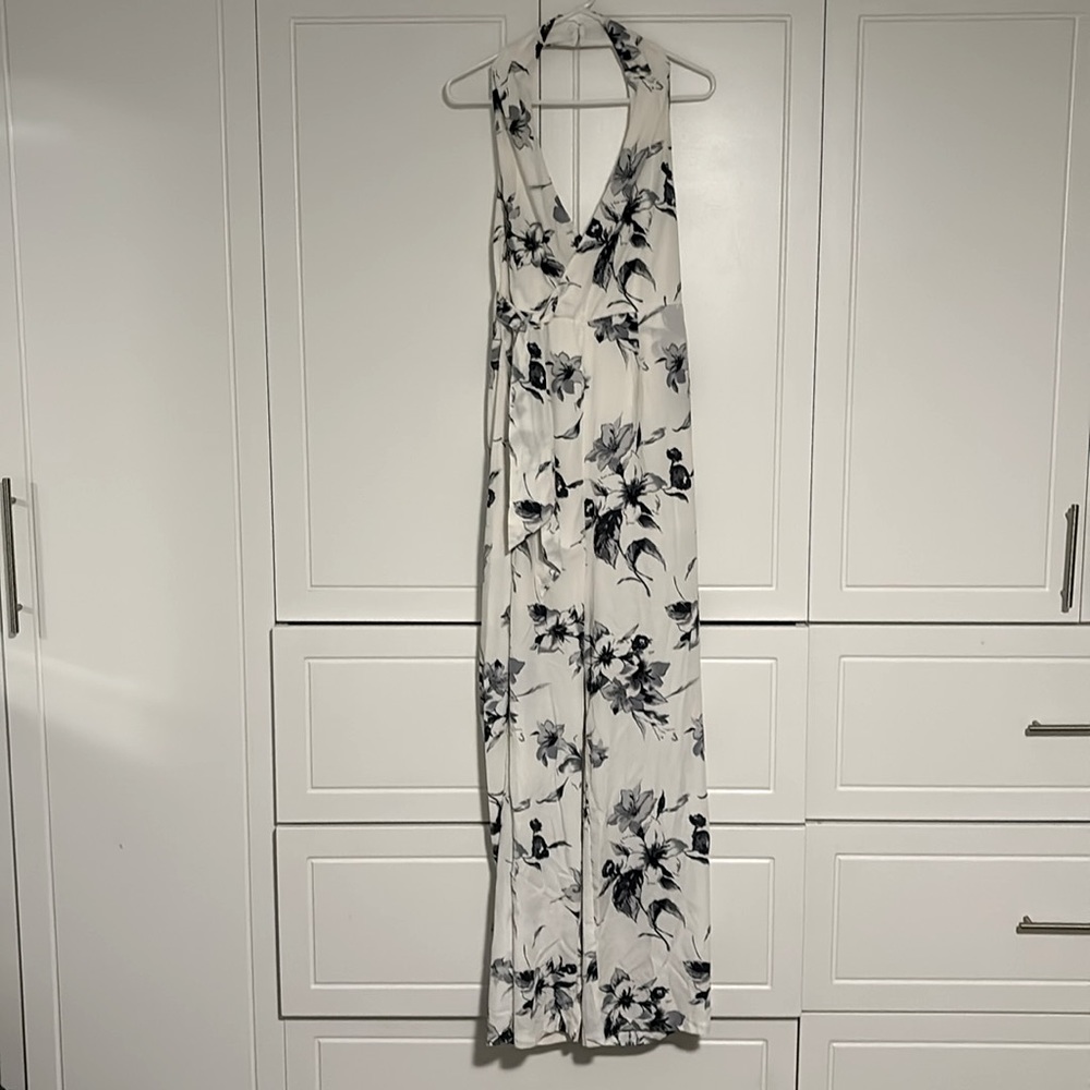 Lightly worn cream w/ charcoal flowers halter jumpsuit. Open back. Size XL.